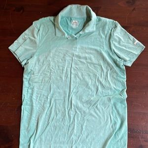 Woman’s teal golf shirt